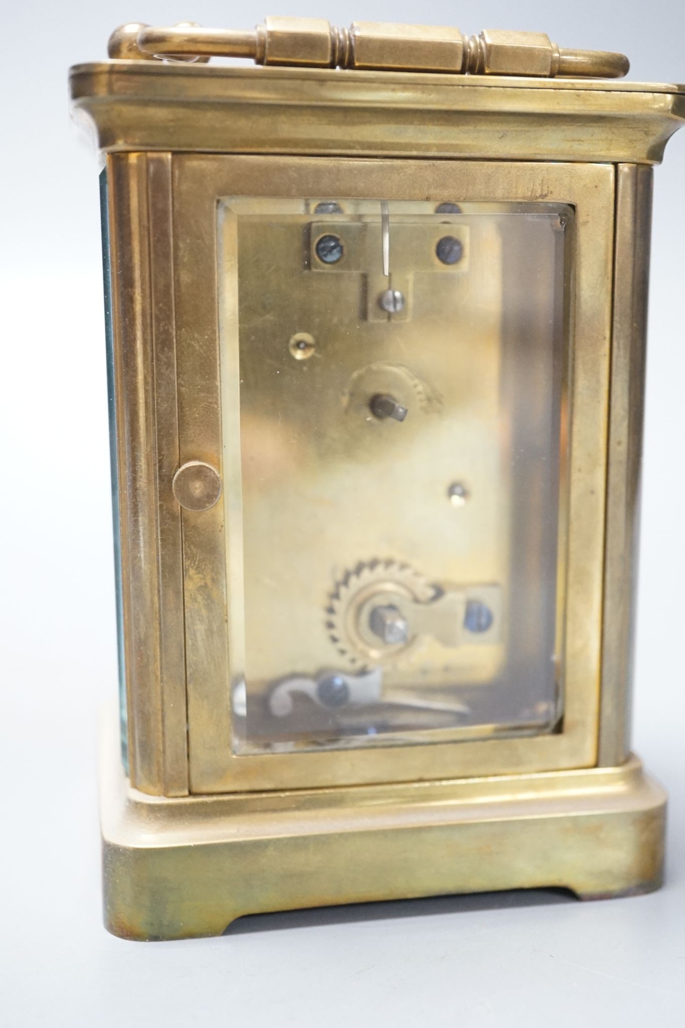A cased brass carriage timepiece, 10.5 cms high high not including case.